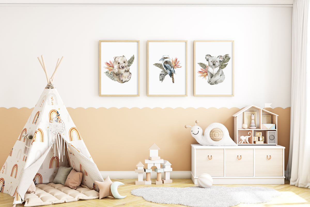 A set of 3 wall oak framed images of Australia animals wombat, kookaburra and koala displayed on the wall of a kids nursery