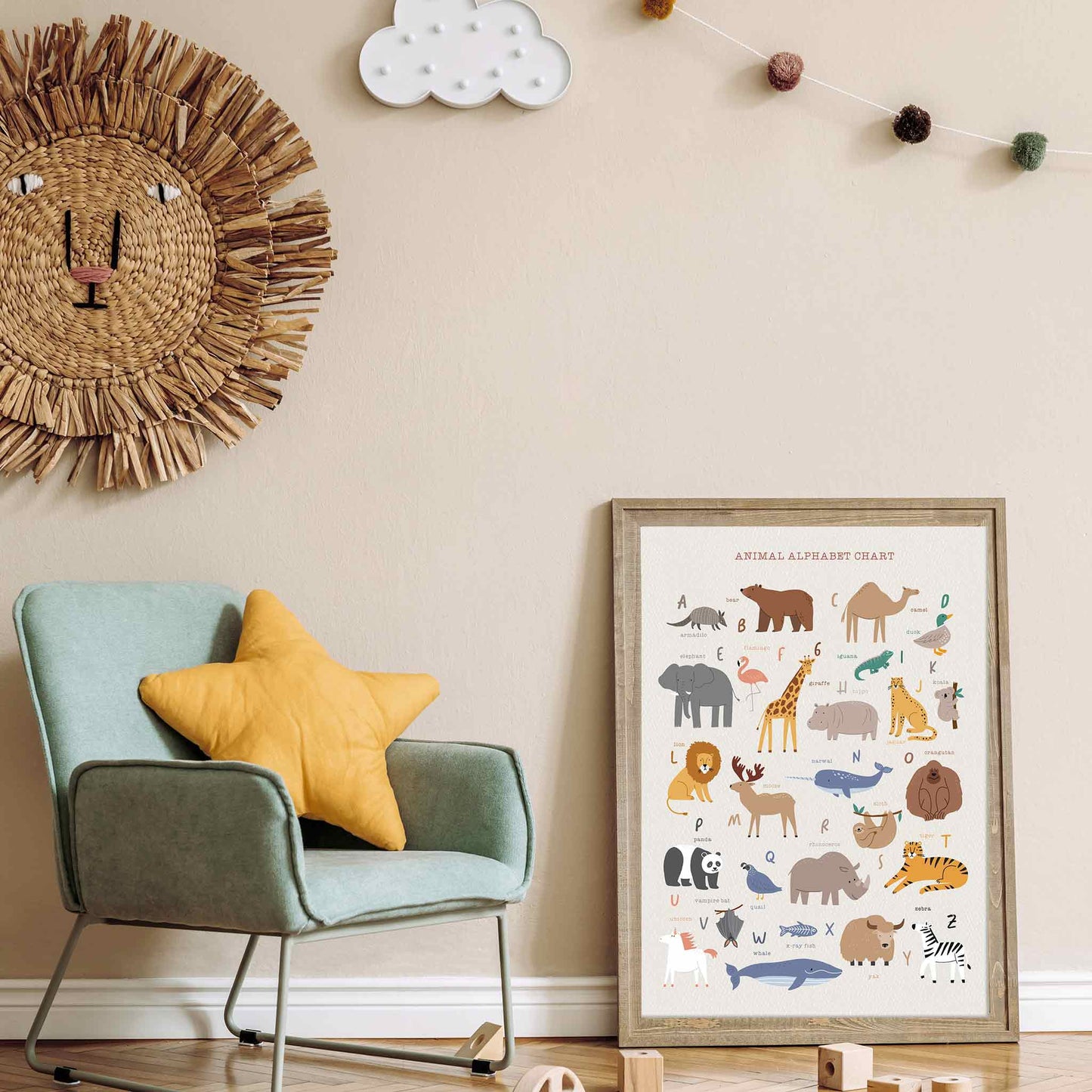 An oak picture frame of a cute Scandinavian animal alphabet poster print in a kids room