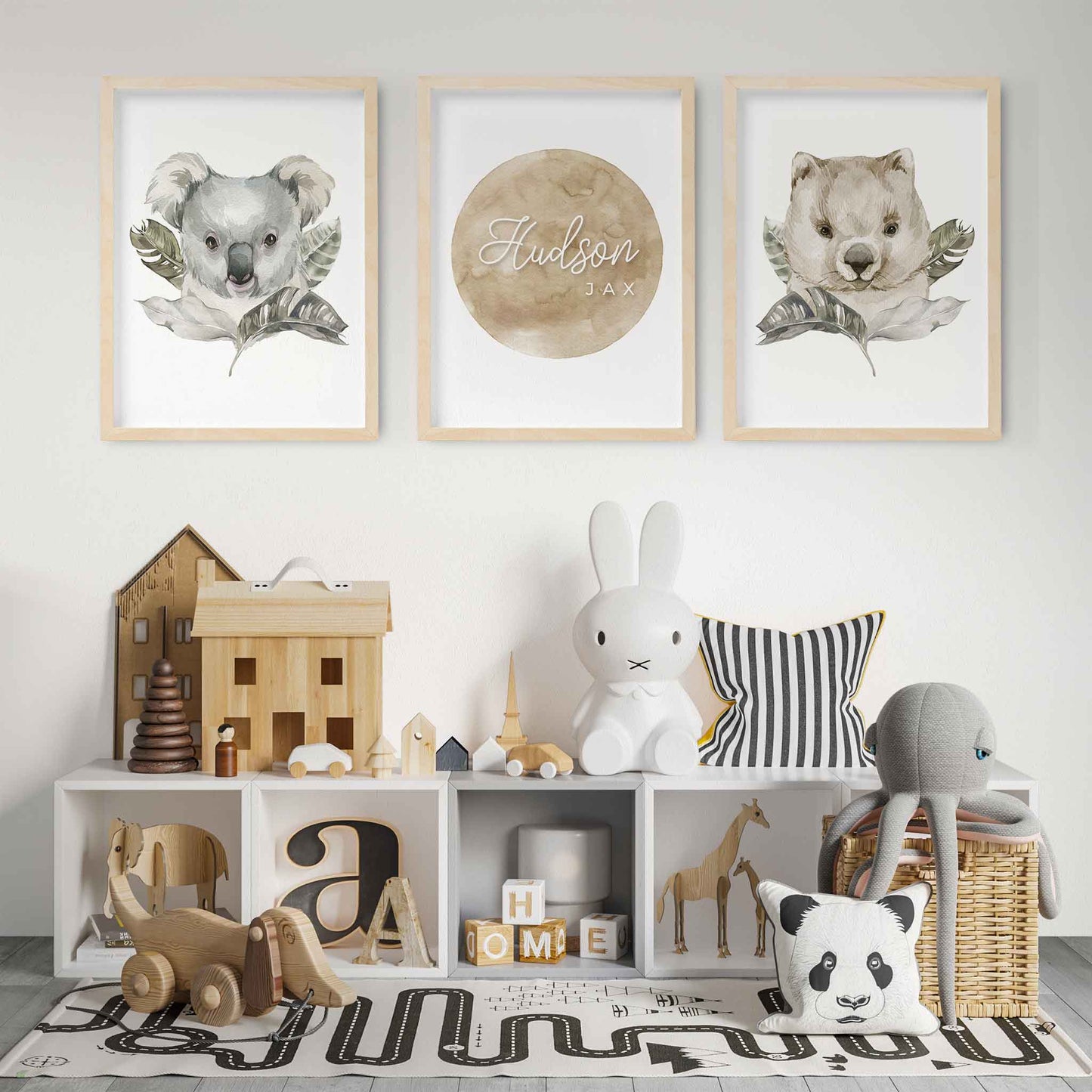 A set of 3 wall oak framed images of Australian wombat and koala featuring a personalised kids name plaque on the wall of a kids playroom