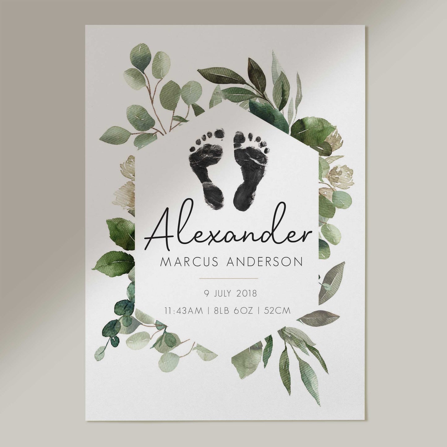 A picture of a botanical baby personalised keepsake footprints birth print decorated in a nursery