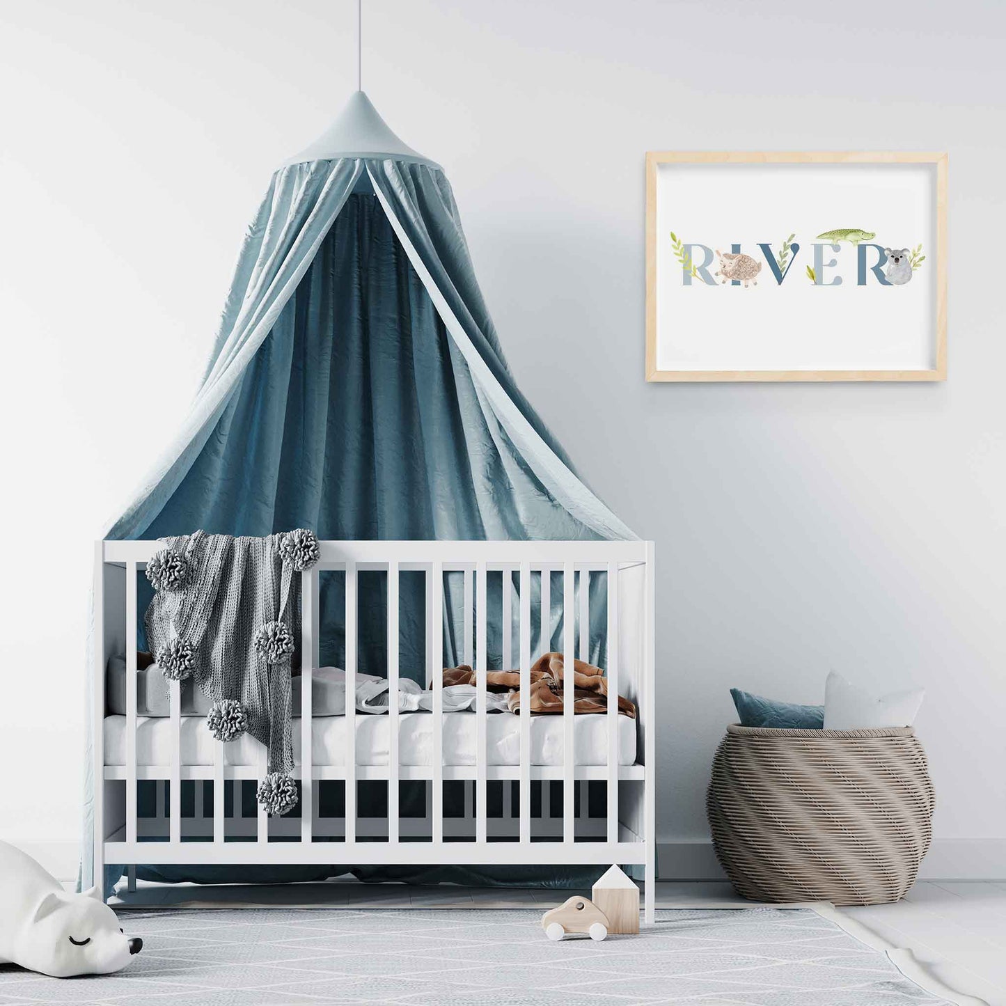 An oak picture frame of a cute animals kids personalised name print decorated in a nursery