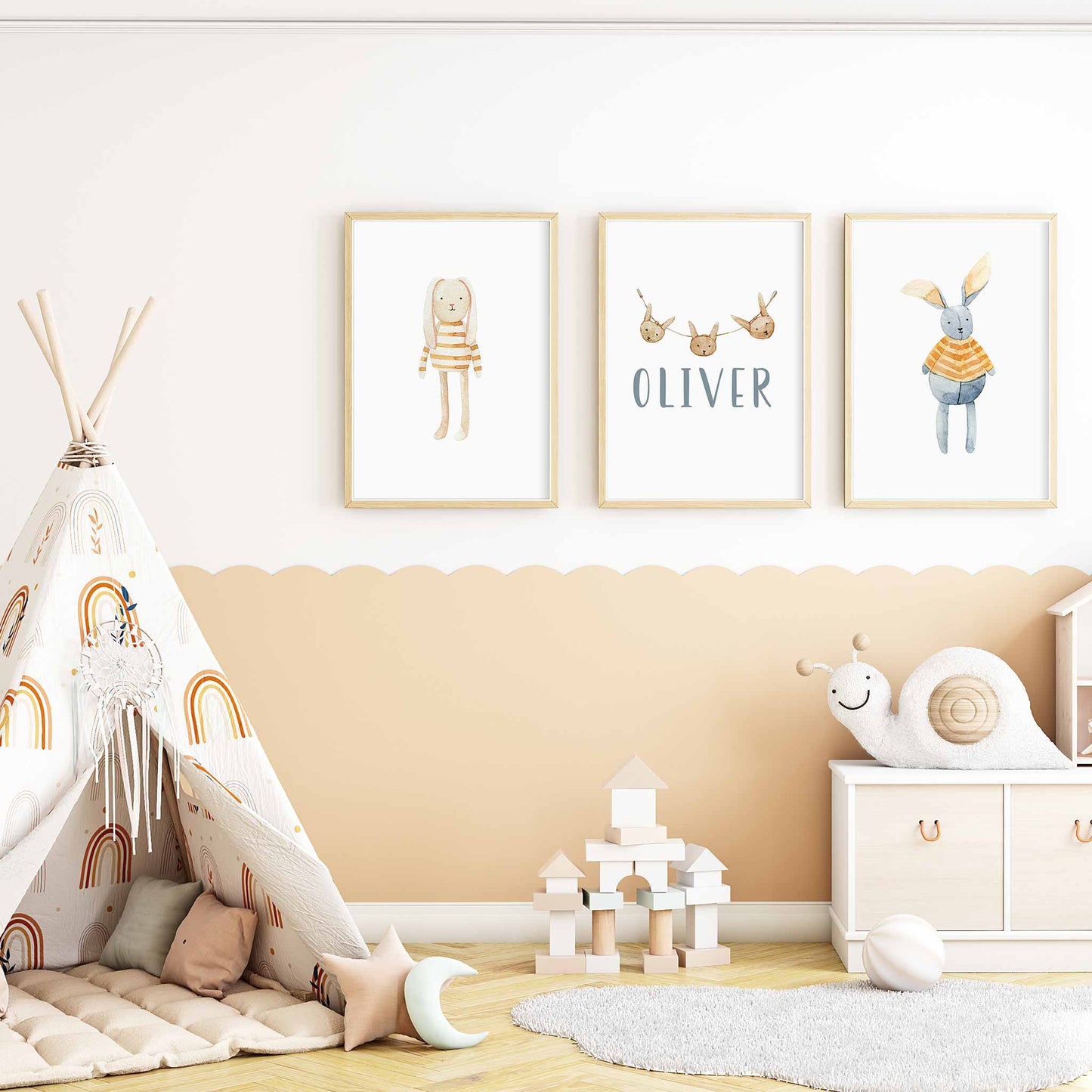 A set of 3 framed oak frames displaying a Scandinavian bunny boys name print decorated in a nursery