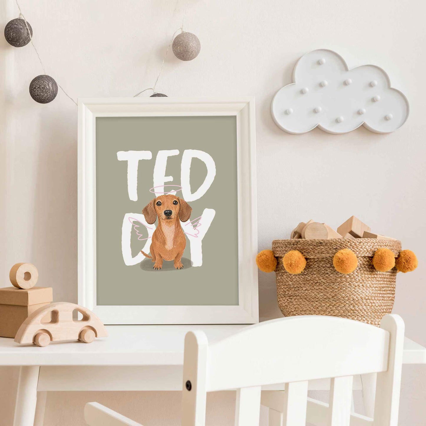 Framed kids pet portrait  with a dachshund illustration and 'Teddy' text in a child's room.