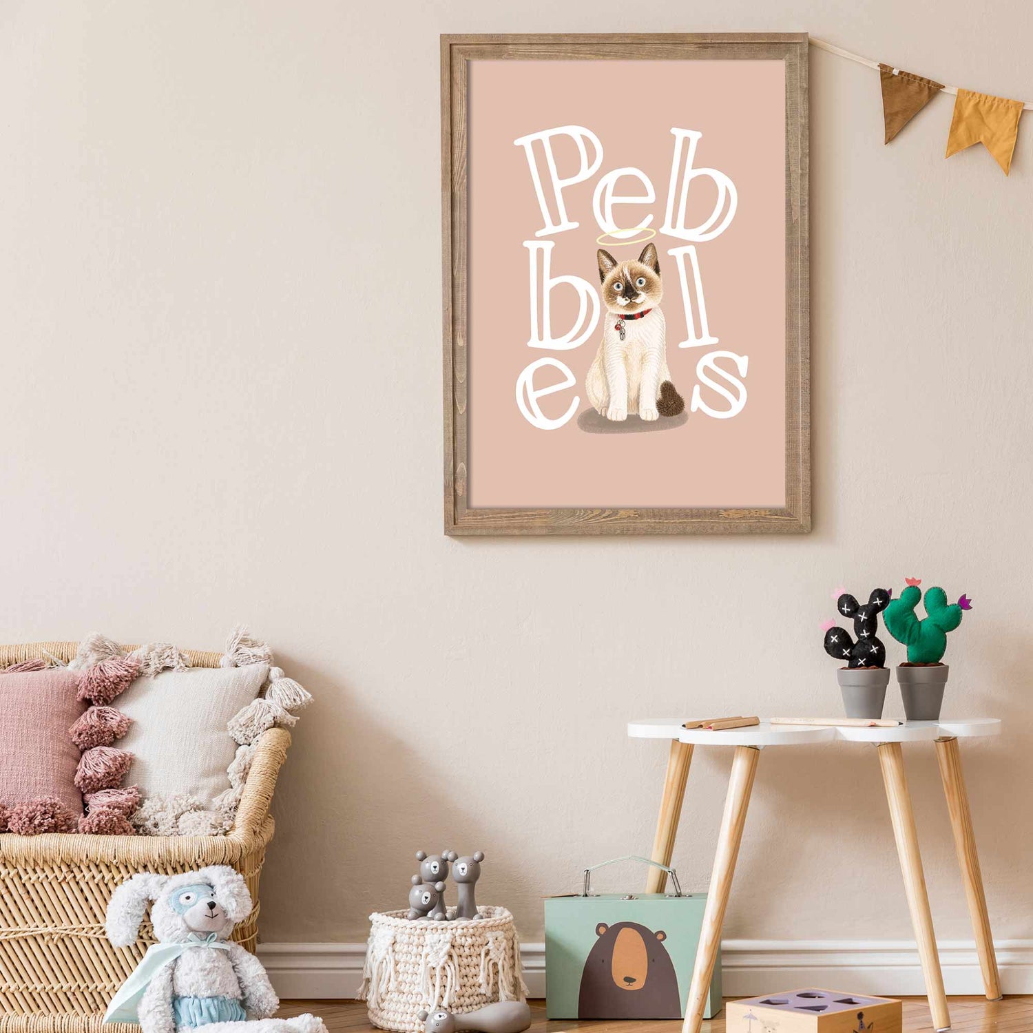Framed kids pet portrait with a cat illustration and 'Pebbles' text in a child's room.