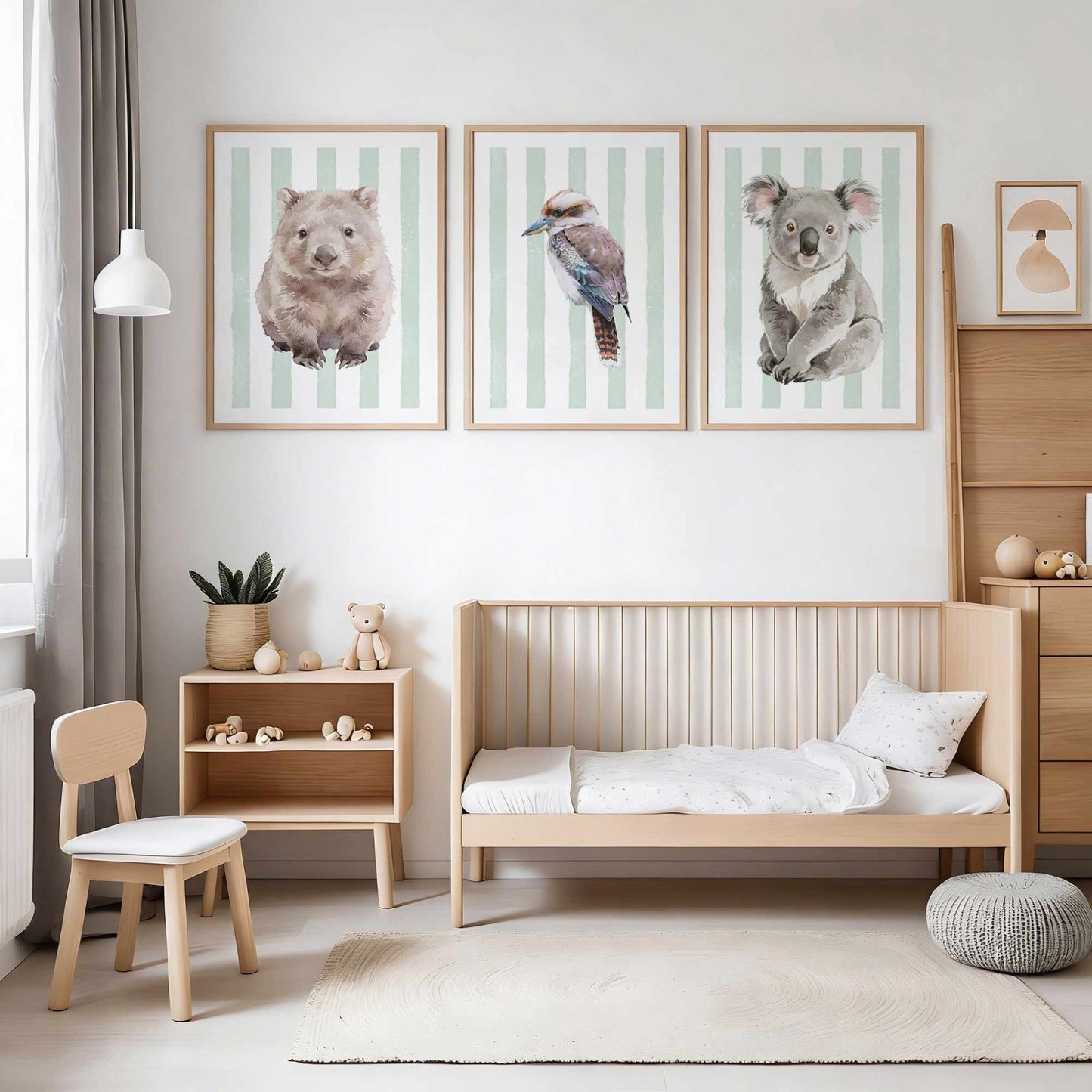 Children's bedroom with wooden furniture, a bed, and wall art of Australian native animals on a striped green background.