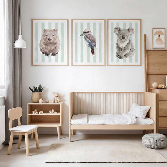 Children's bedroom with wooden furniture, a bed, and wall art of Australian native animals on a striped green background.