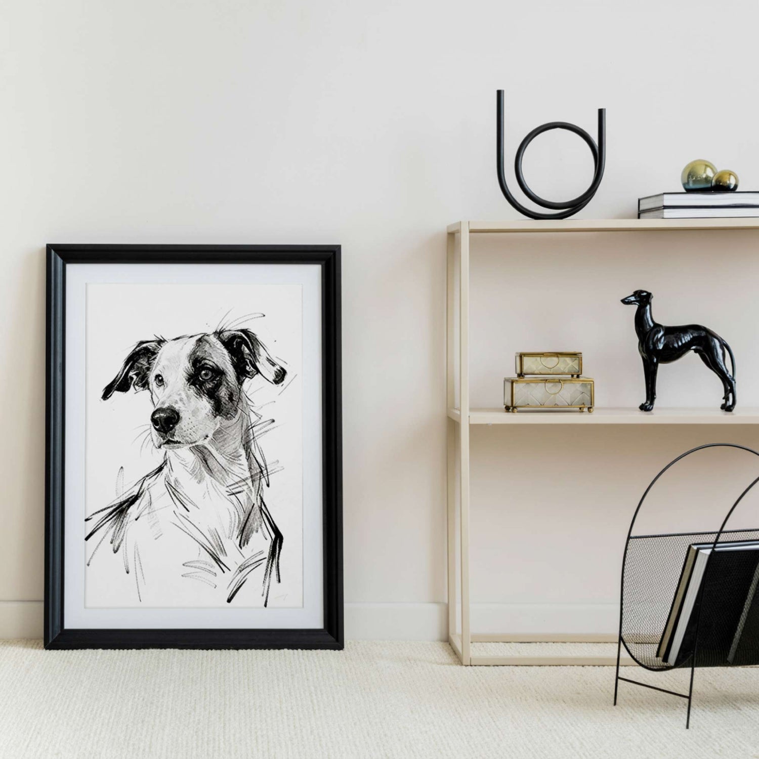 Framed sketch style dog portrait styled on shelf with decor