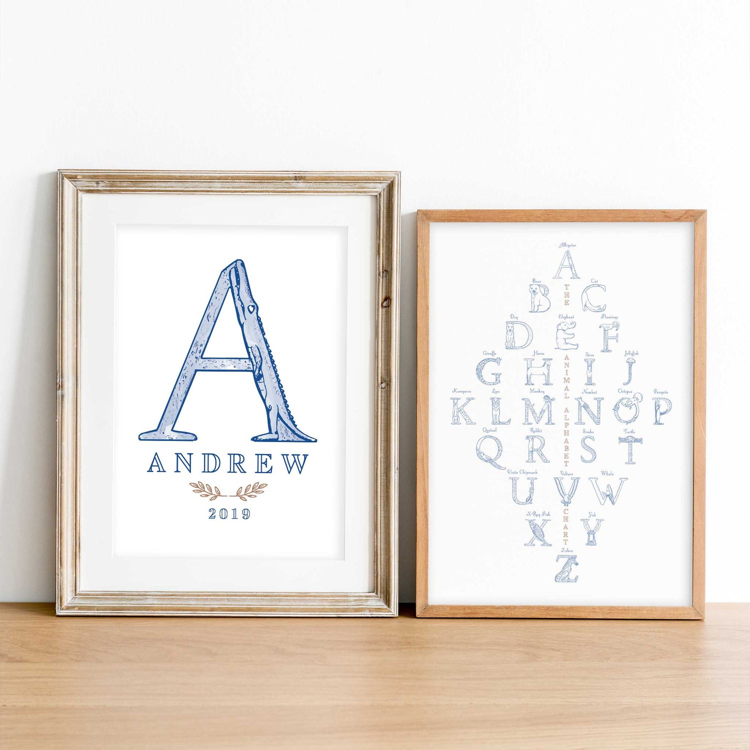 A set of oak picture frames of blue monogram name print and alphabet shape animal chart