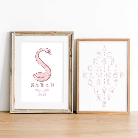 A set of oak picture frames of pink monogram name print and alphabet shape animal chart