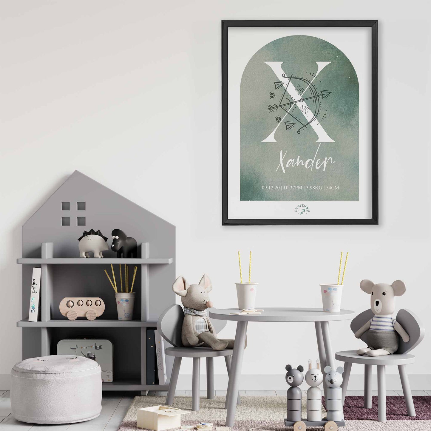 A framed black frame of a green watercolor arch display personalised horoscope birth print with Zodiac symbol and constellation in a baby nursery room