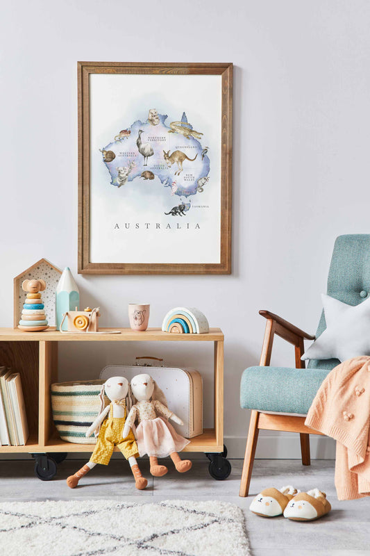 An wooden framed image of Australia map featuring Australian native animals in an opal finish displayed on the wall of a kids bedroom