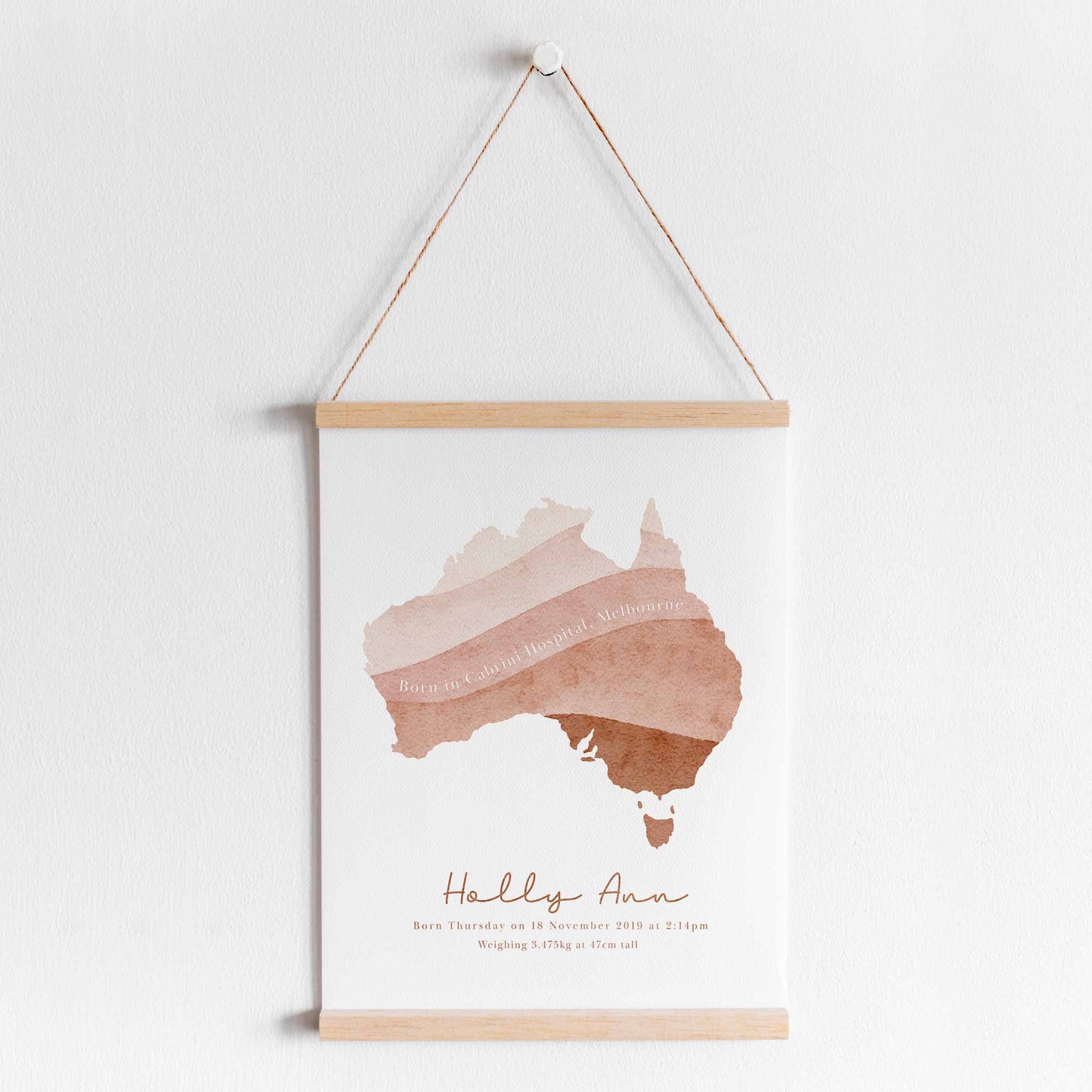 Hanging frame of a brown ombre Australia map personalised birth print details