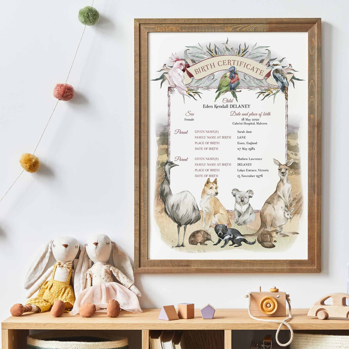 A wall oak framed image of Australia native animals; wombat, kookaburra, koala, kangaroo, emu, dingo, echidna, Tasmanian devil, platypus, cockatoo, and budgies in the Australian outback displayed in a kids playroom