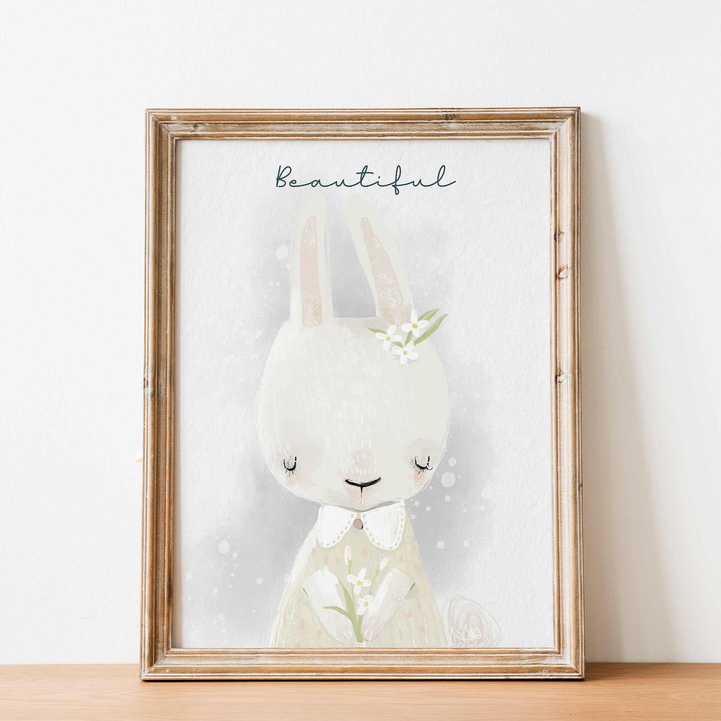 An oak frame of a cute whimsical bunny rabbit with inspirational quote