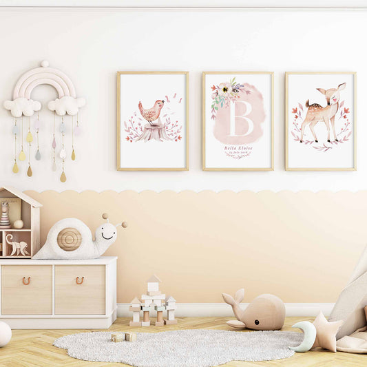 A set of 3 framed images of woodland bird and deer monogram nursery personalised birth print decorated in a nursery