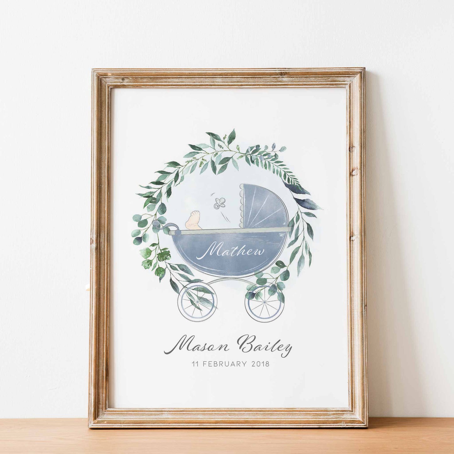 An oak picture frame of a botanical wreath baby pram personalised birth print 