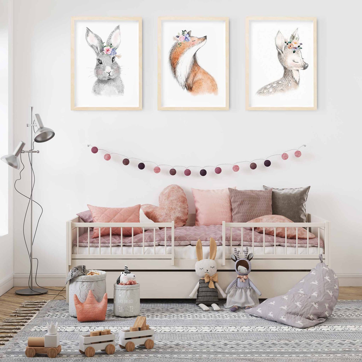 A set of 3 framed images of woodland bunny rabbit, fox and deer floral nursery kids print decorated in a nursery