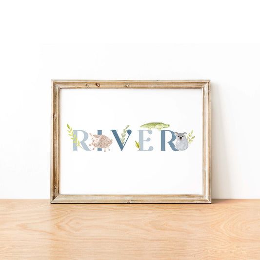 An oak picture frame of a cute animals kids personalised name print in blue