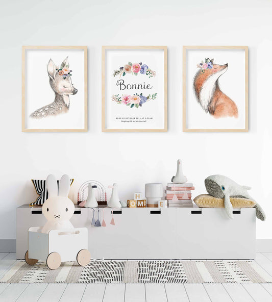 A set of 3 framed images of woodland deer and fox floral half wreath nursery personalised birth print decorated in a nursery