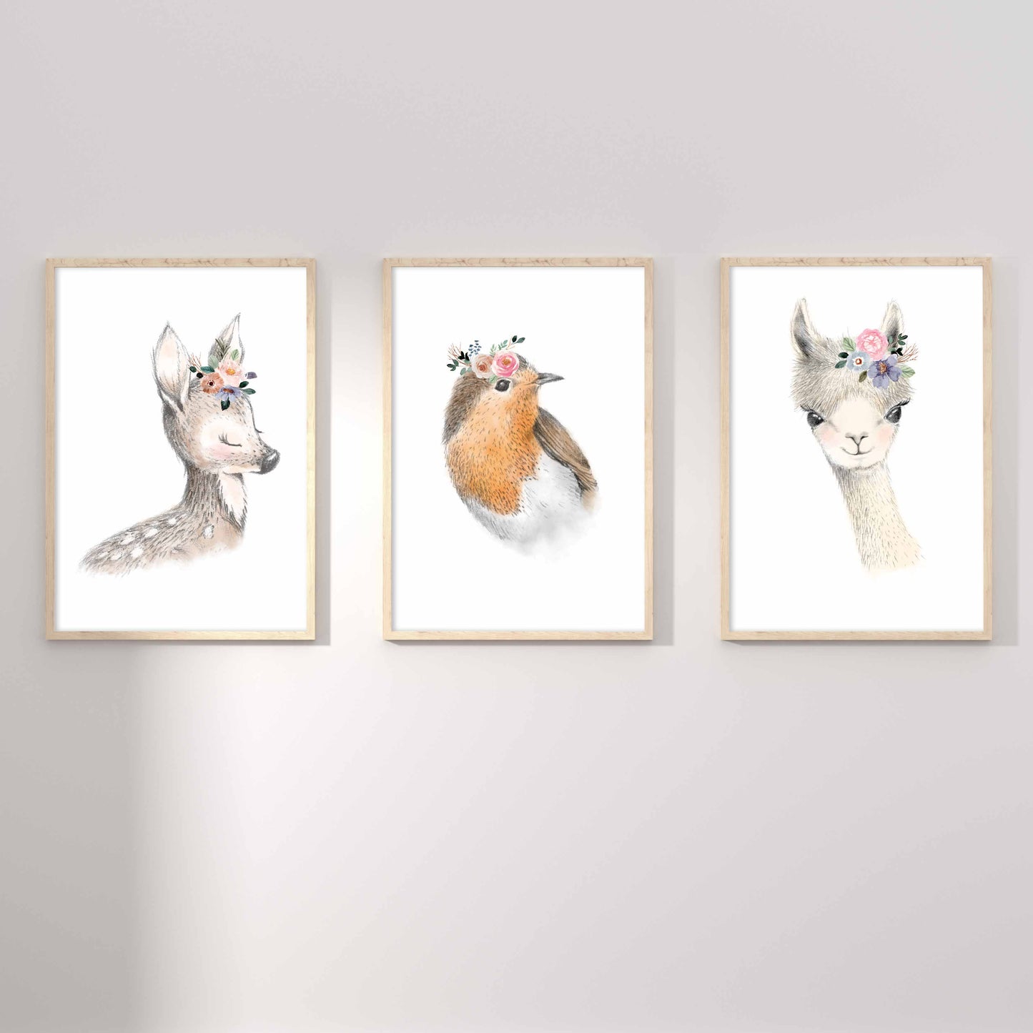 A set of 3 framed images of woodland deer, bird and llama floral nursery kids prints