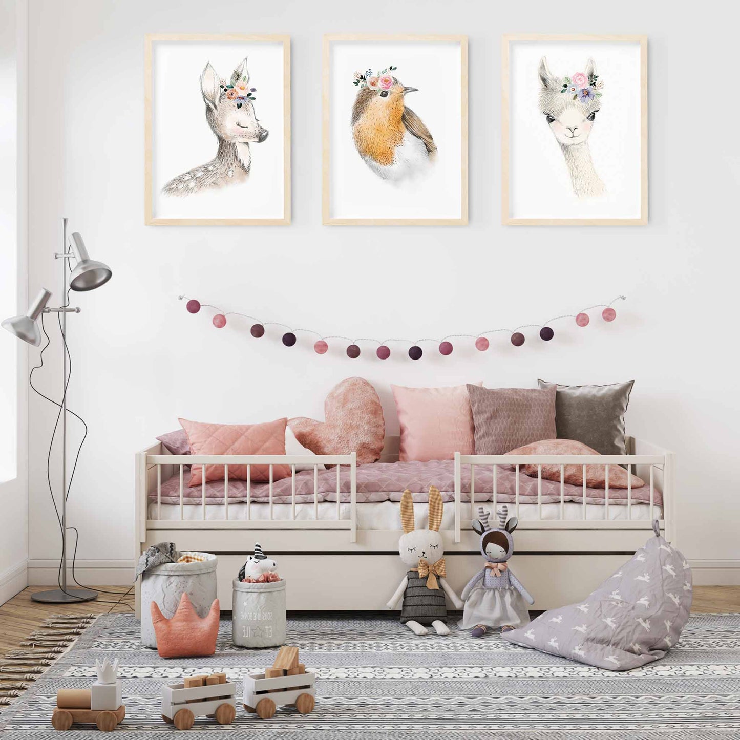 A set of 3 framed images of woodland deer, bird and llama floral nursery kids print decorated in a nursery