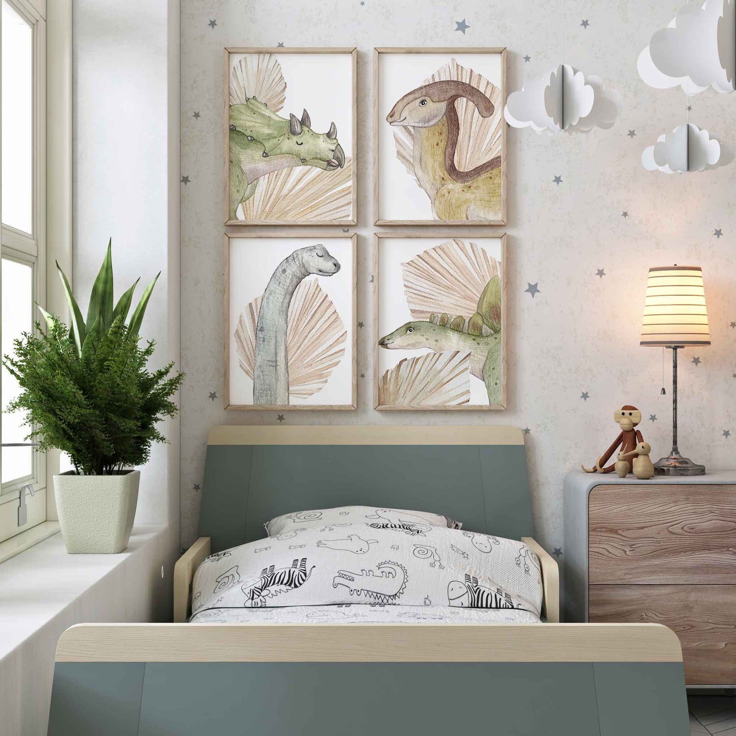 A set of 4 wall framed art of dinosaurs and dried palm leaves prints displayed on the wall of a kids room