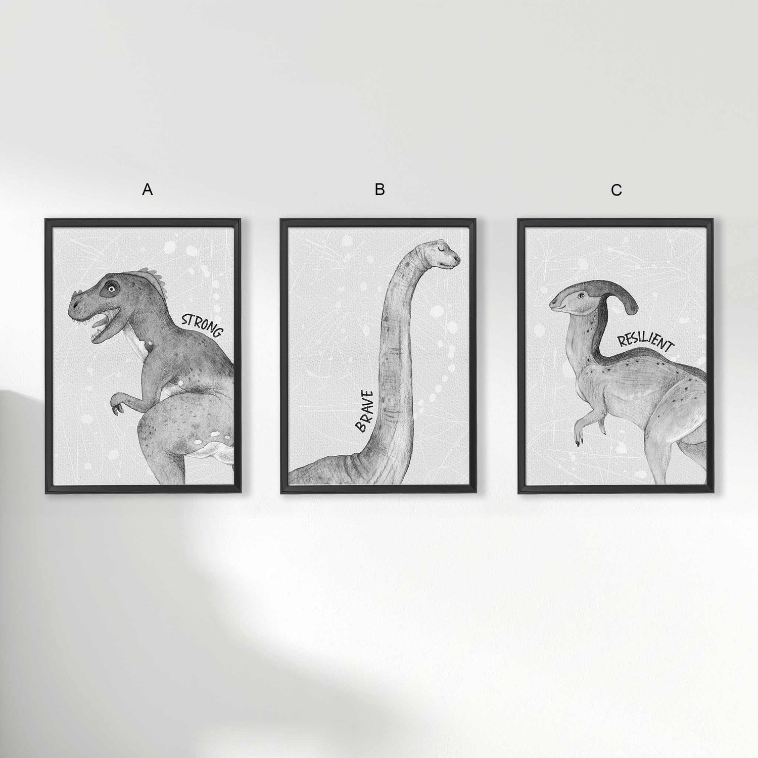 A set of 3 framed black frames displaying kids nursery aspirational wall prints of dinosaur monochromatic sketched art  Edit alt text