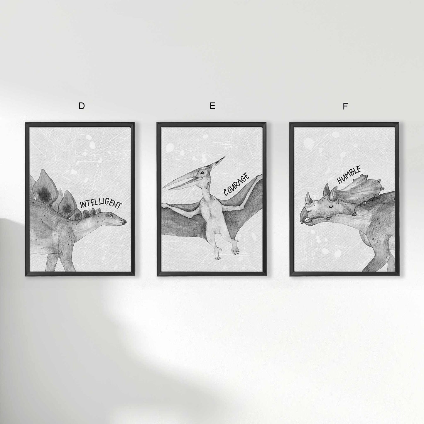 A set of 3 framed black frames displaying kids nursery aspirational wall prints of dinosaur monochromatic sketched art