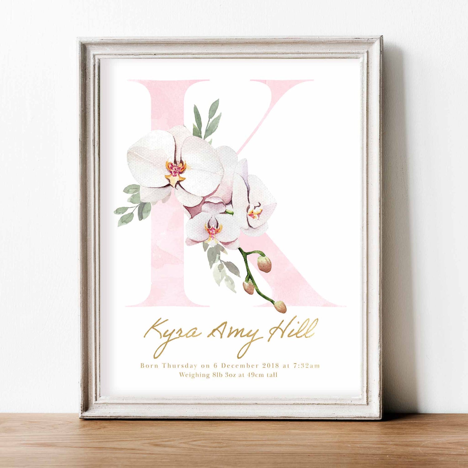 A white frame of floral orchid pink gold monogram nursery personalised birth print