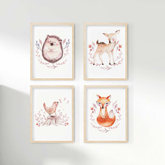A set of 4 framed oak frames displaying woodland hedgehog, deer, bird and fox nursery prints
