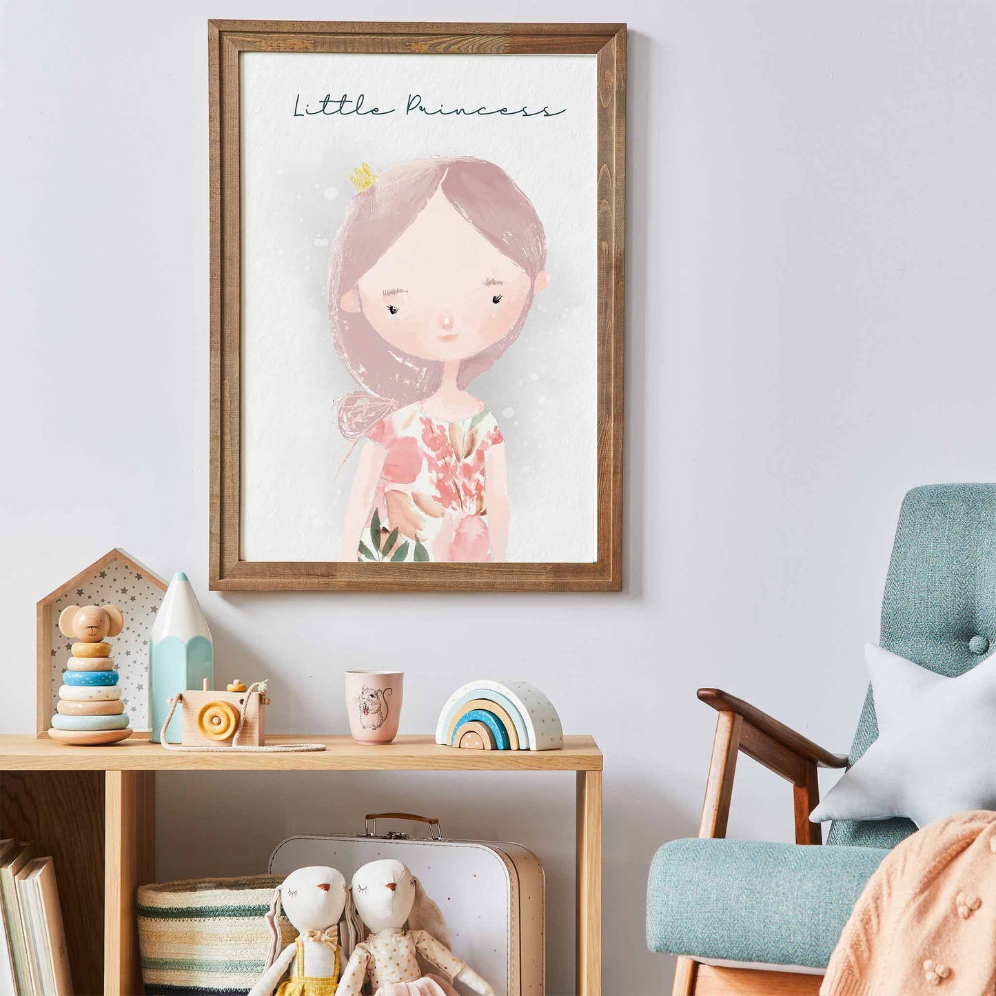 An oak frame of a cute whimsical little princess with inspirational quote decorated in a kids room