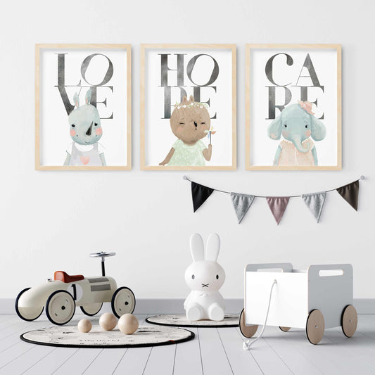 A set of 3 oak frames of a rhino, bear and elephant inspirational quotes kids prints decorated in a nursery room