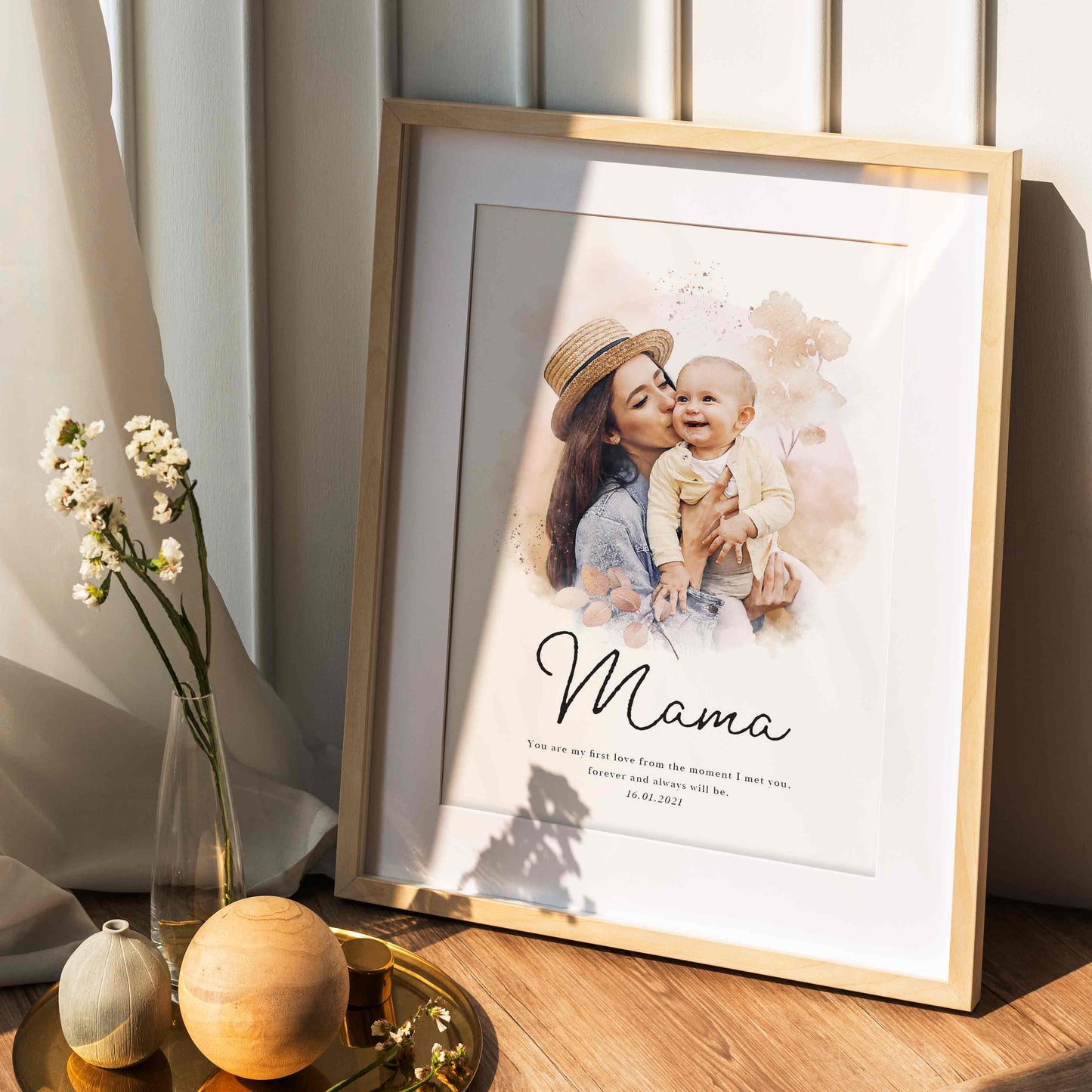 A picture frame of a personalised mother and child portrait print displayed on a table