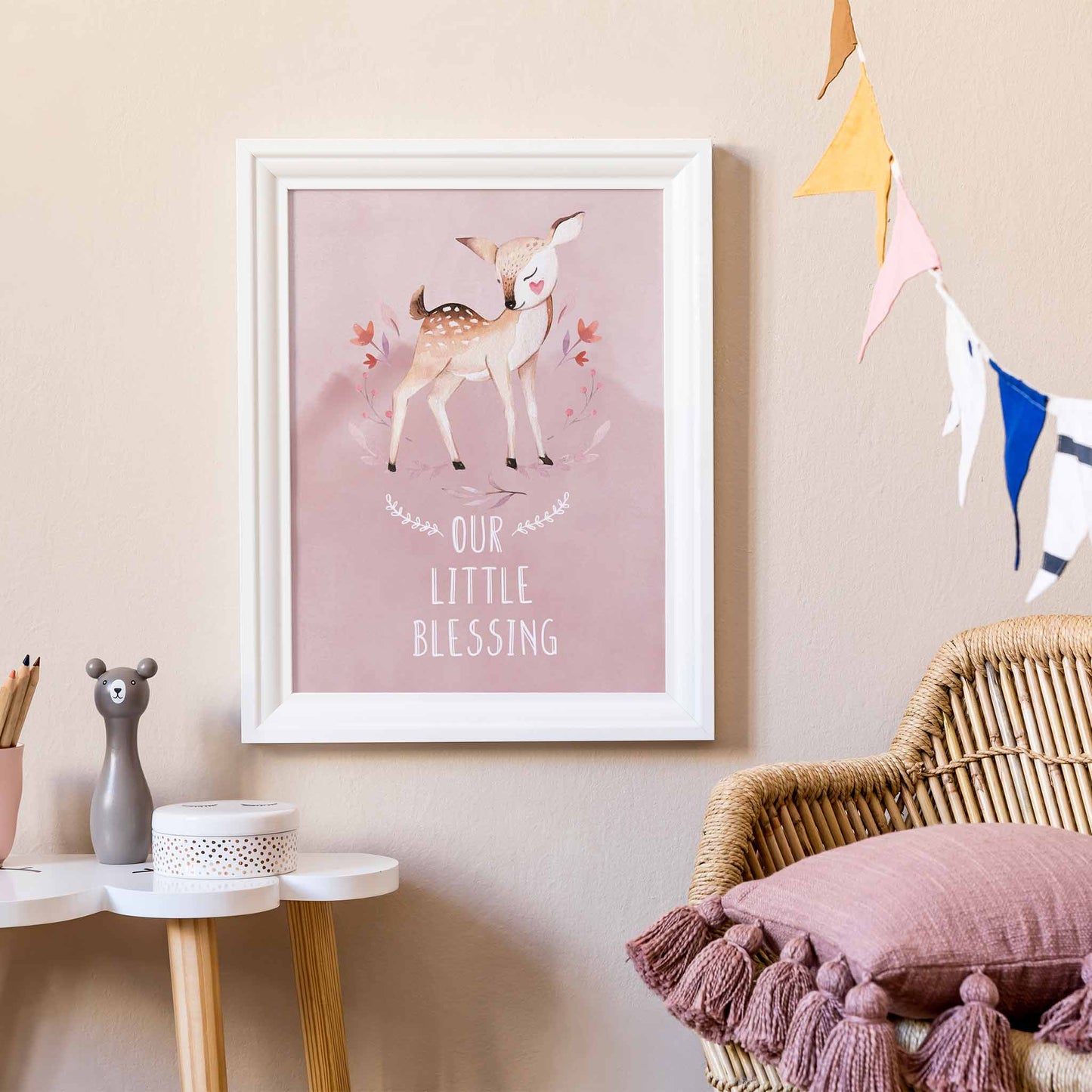 An white frame of a cute woodland deer with inspirational quote decorated in a living room