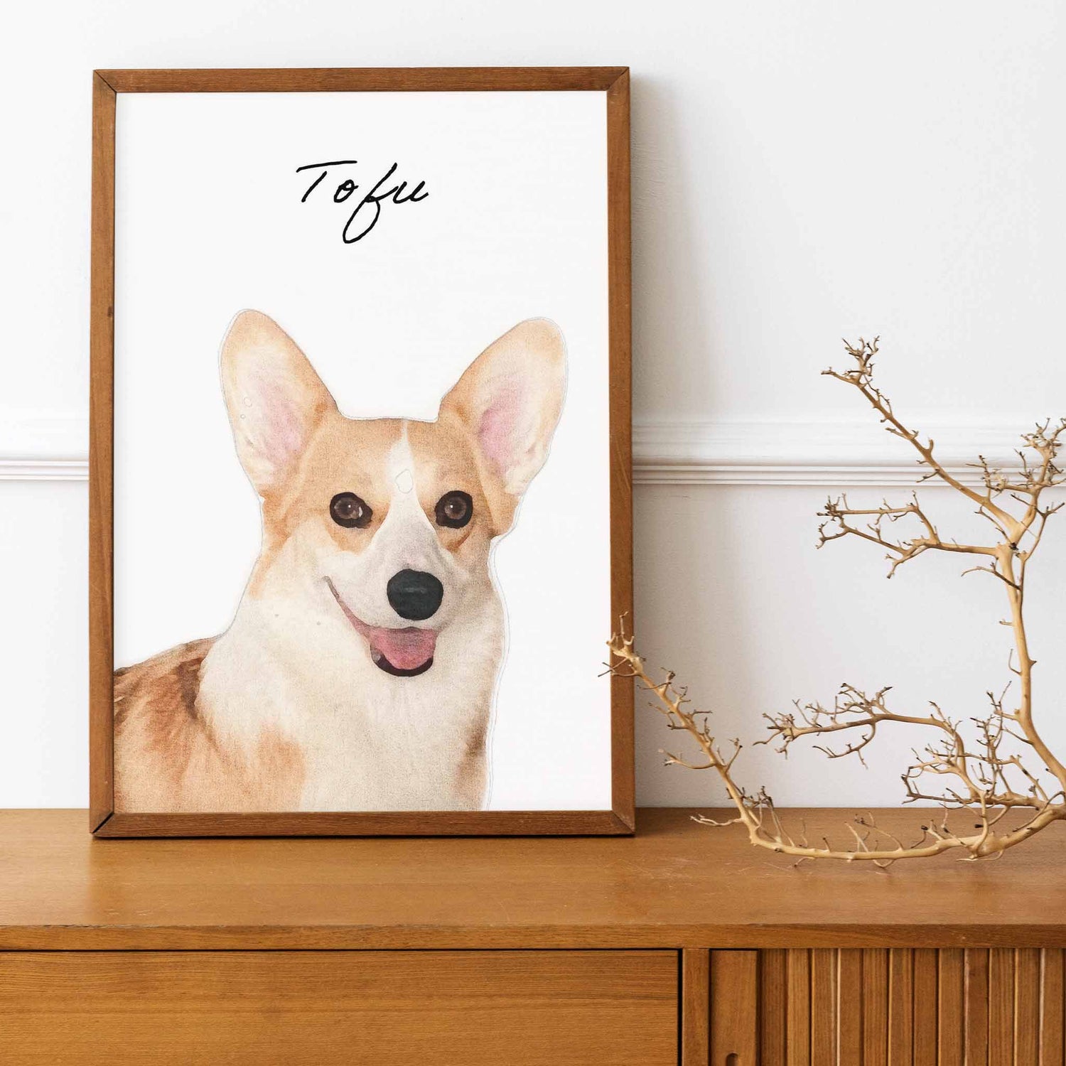 A wooden frame of a custom dog portrait decorated in a living room