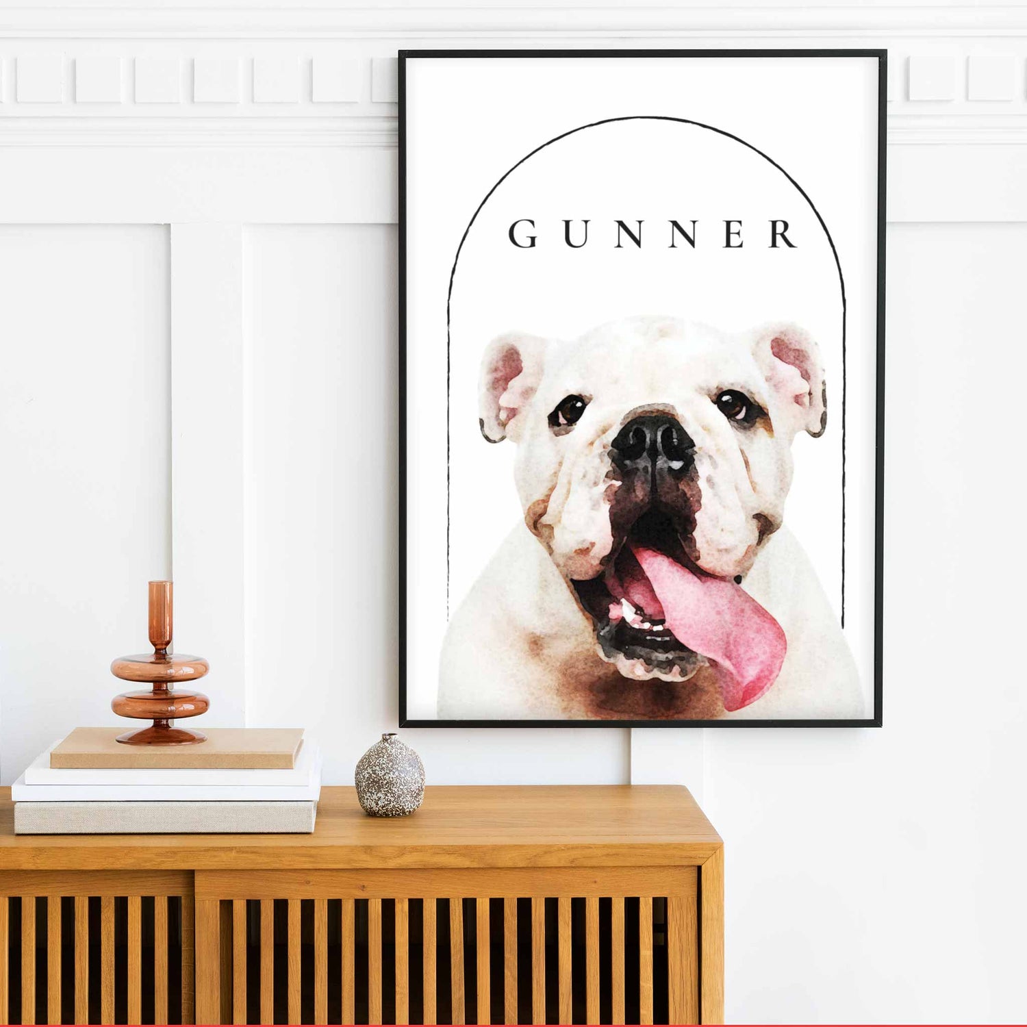 A black frame of a custom dog portrait decorated in a living room