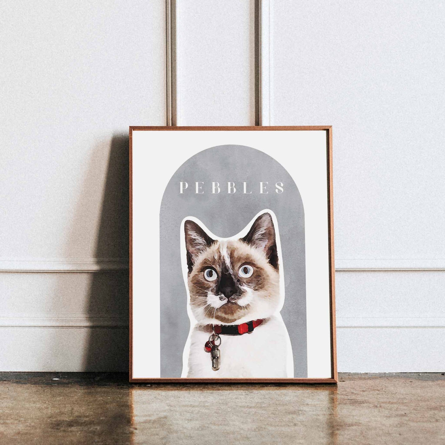 A wooden frame of a custom cat portrait decorated in a living room