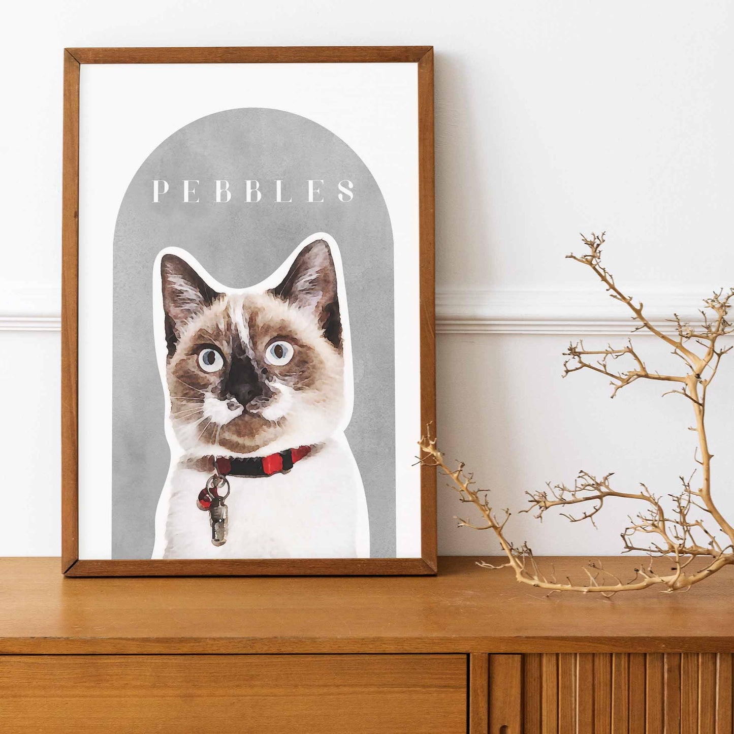 A wooden frame of a custom cat portrait decorated in a living room