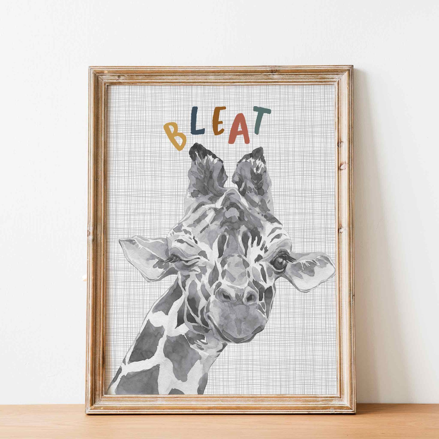 An oak picture frame of a cute watercolour baby giraffe