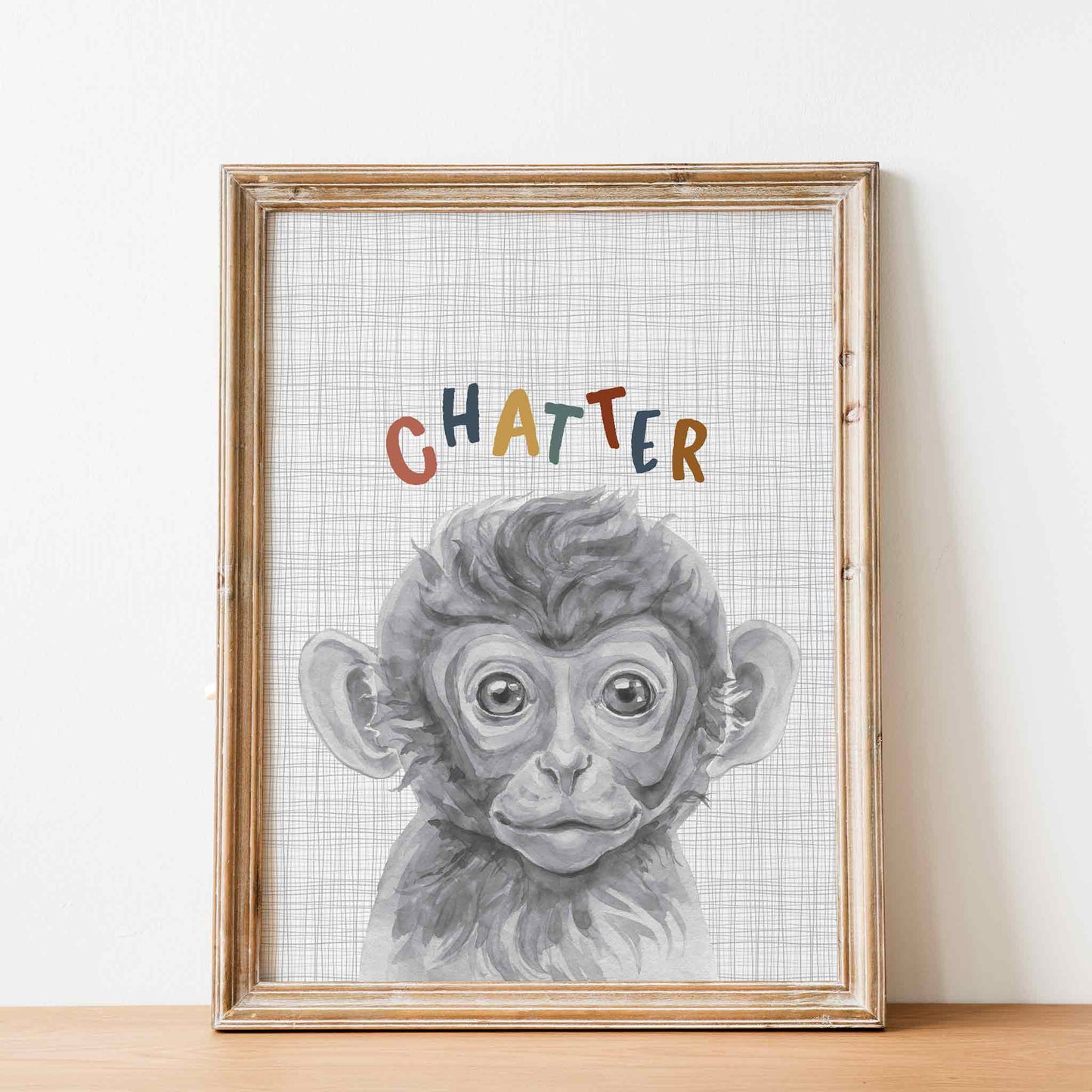 An oak picture frame of a cute watercolour baby monkey