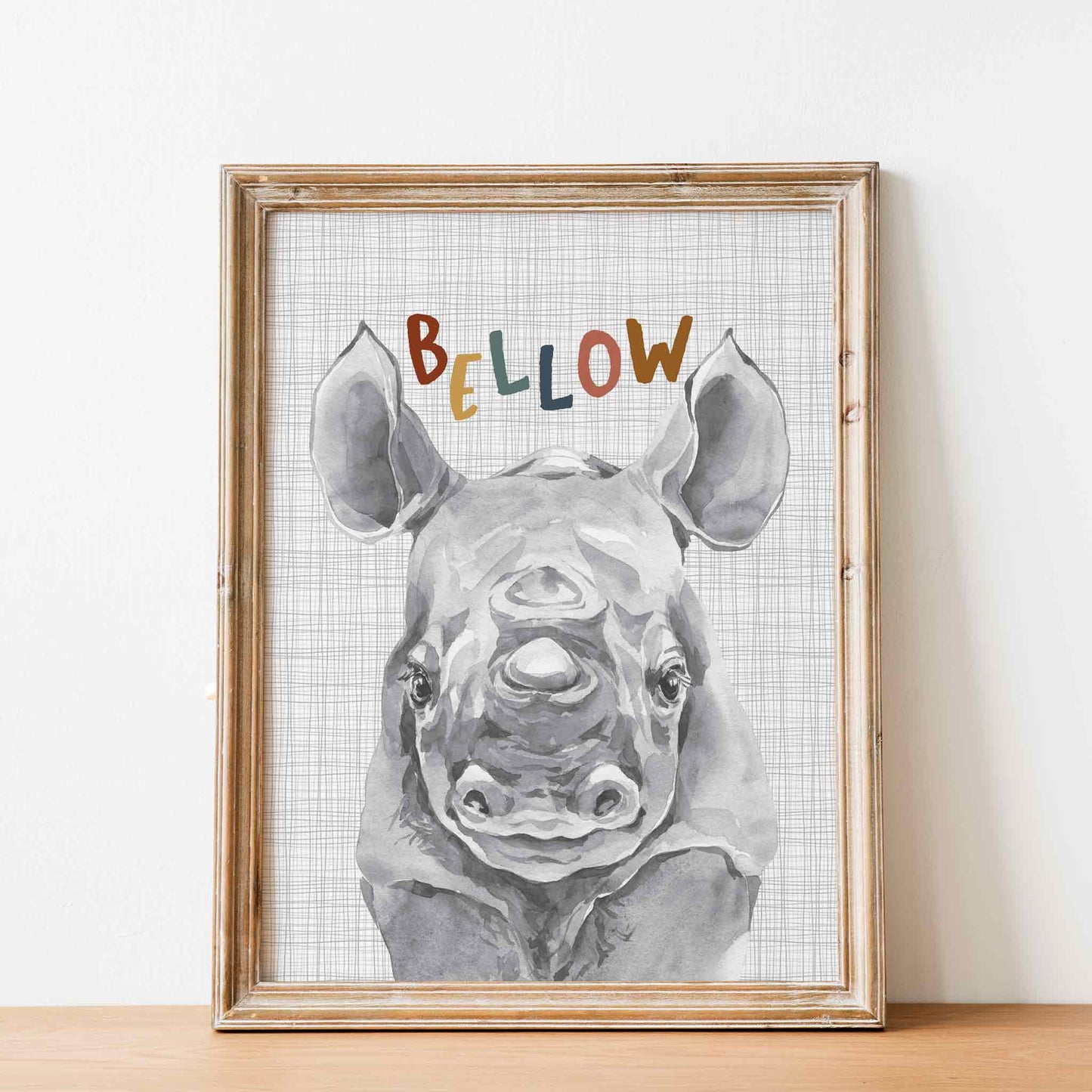 An oak picture frame of a cute watercolour baby rhino