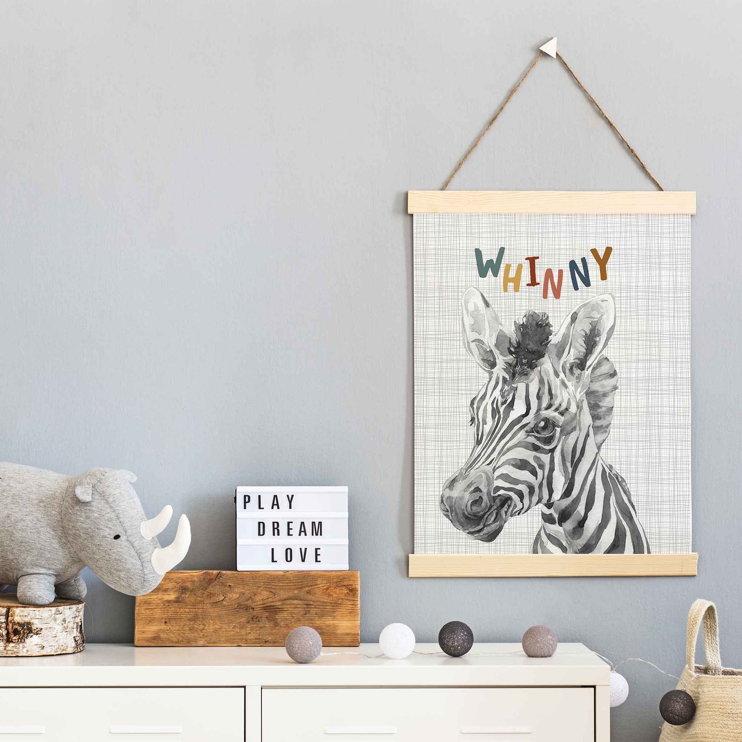 An oak picture frame of a cute watercolour baby zebra decorated in a kids room