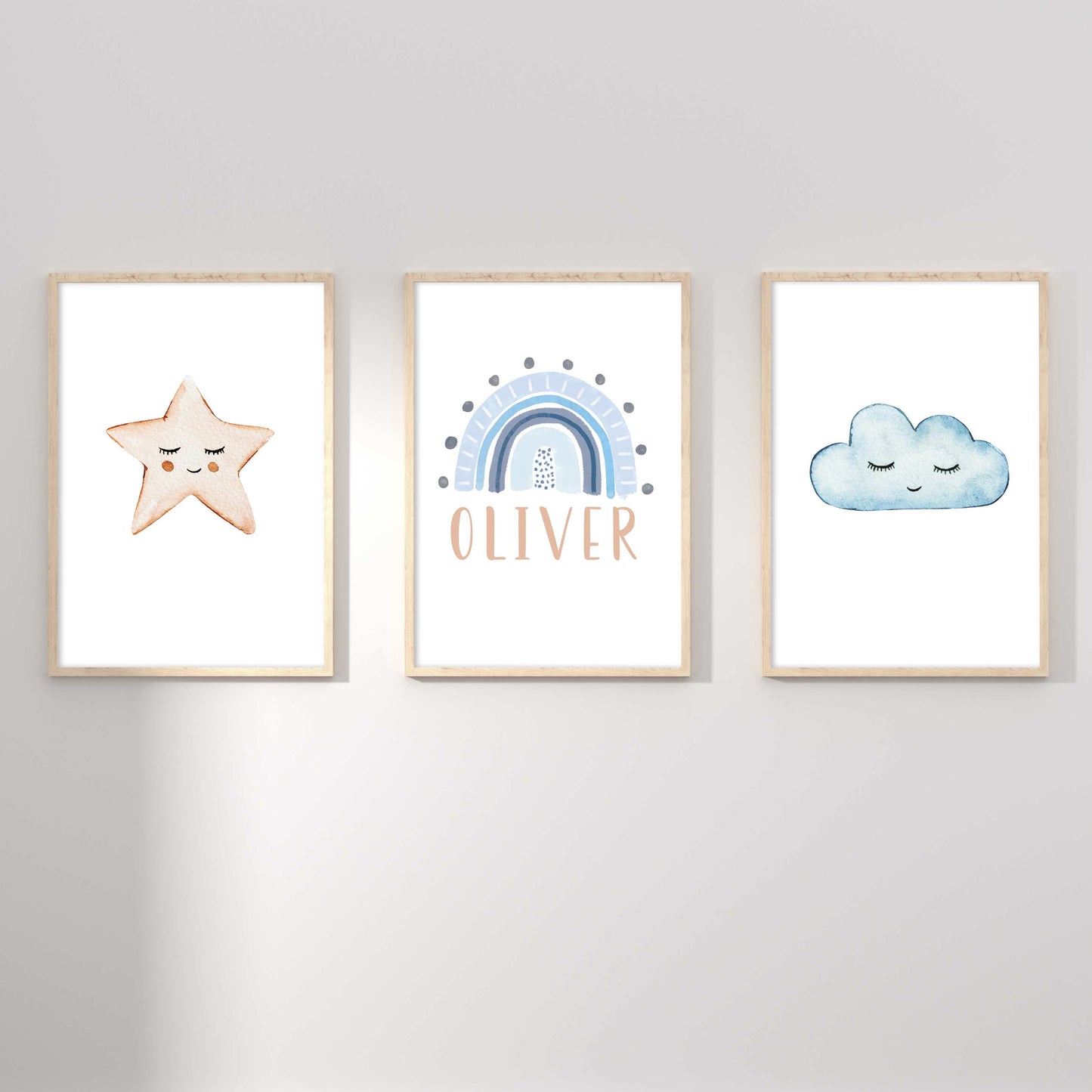 A set of 3 framed oak frames displaying a star, rainbow and cloud boy's name print 