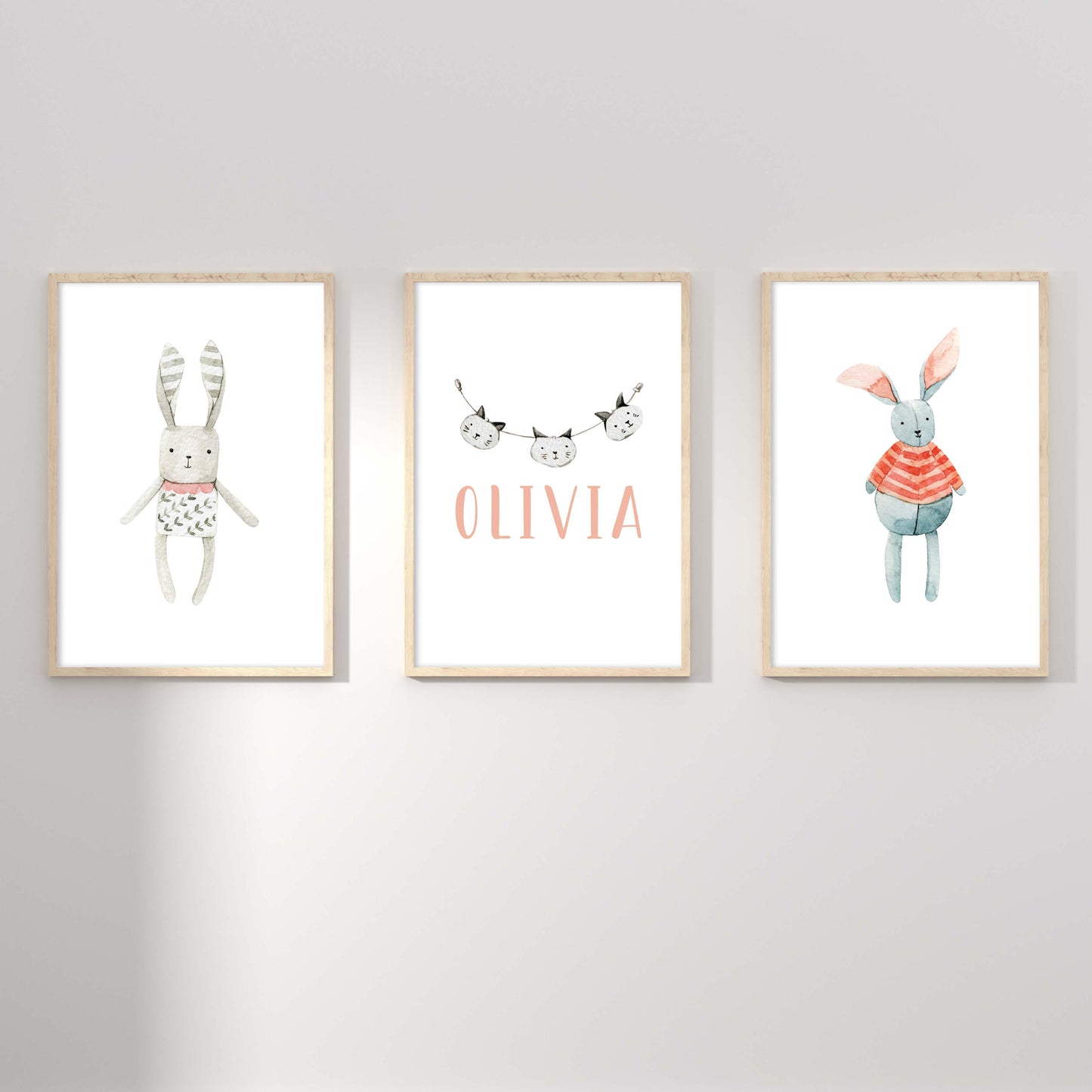 A set of 3 framed oak frames displaying a Scandinavian bunny and cat girl's name print