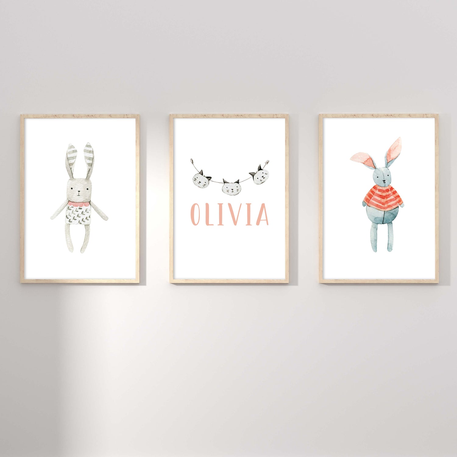 A set of 3 framed oak frames displaying a Scandinavian bunny and cat girl's name print