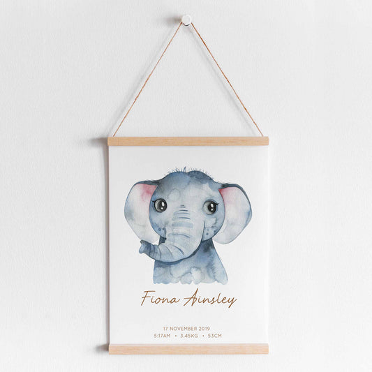 A hanging frame of a watercolour elephant kids personalised birth print