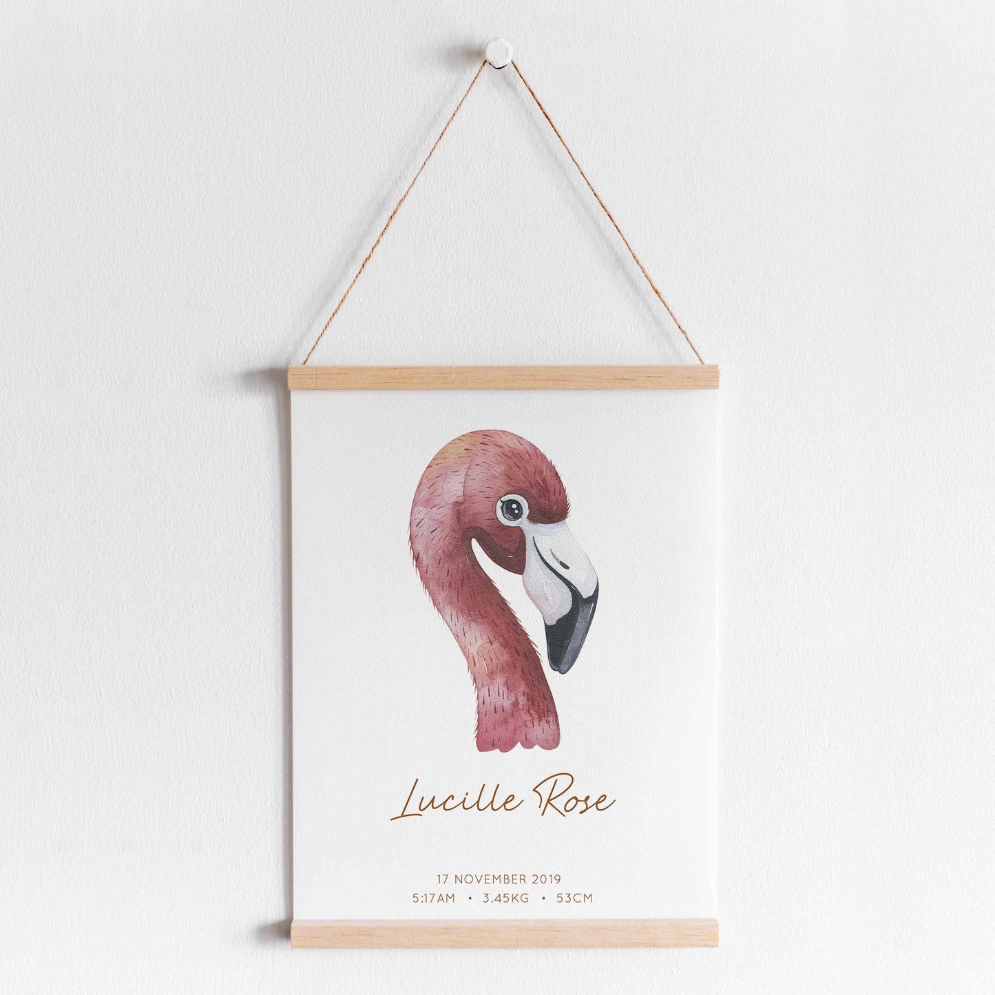 A hanging frame of a watercolour flamingo kids personalised birth print