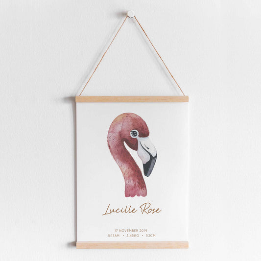 A hanging frame of a watercolour flamingo kids personalised birth print