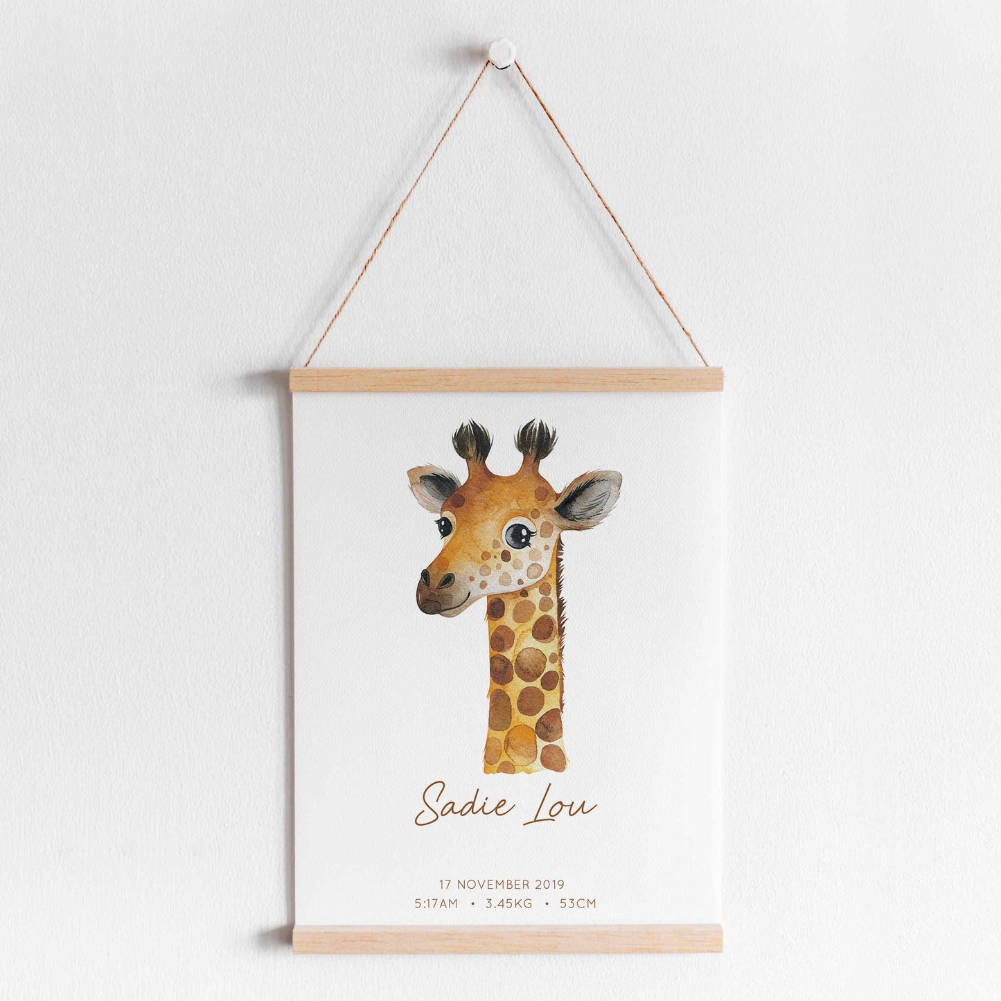 A hanging frame of a watercolour giraffe kids personalised birth print