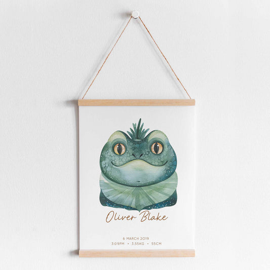 A hanging frame of a watercolour iguana kids personalised birth print